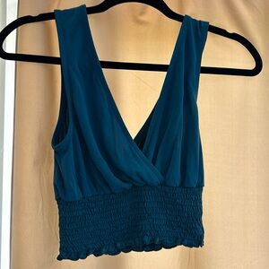 Forever 21 size small crop top. Good condition. Is more teal in person.